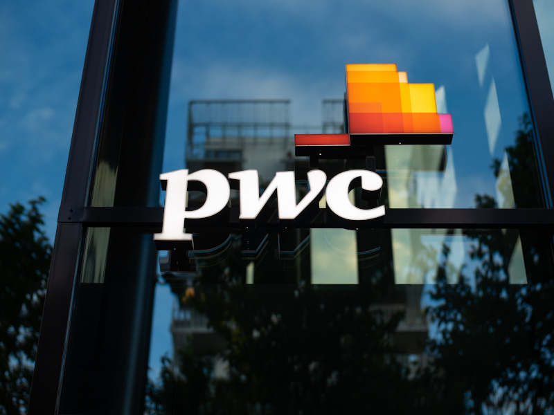 The PwC logo on a window.