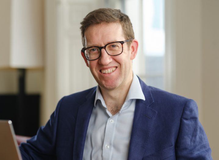 Image of doctor Brian MacNamee sitting at a desk.