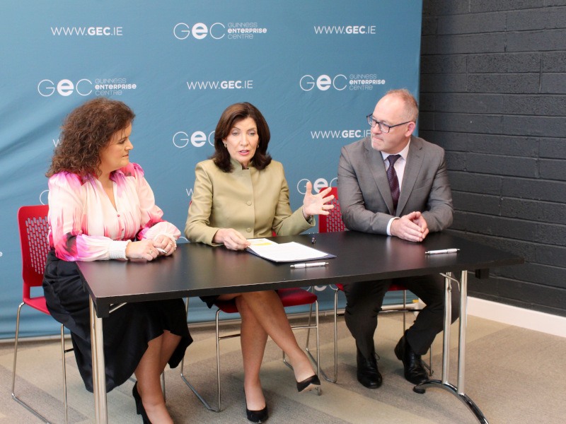 Two women and a man sitting together at a table. They are part of the GEC, Furthr and the state of New York's government.