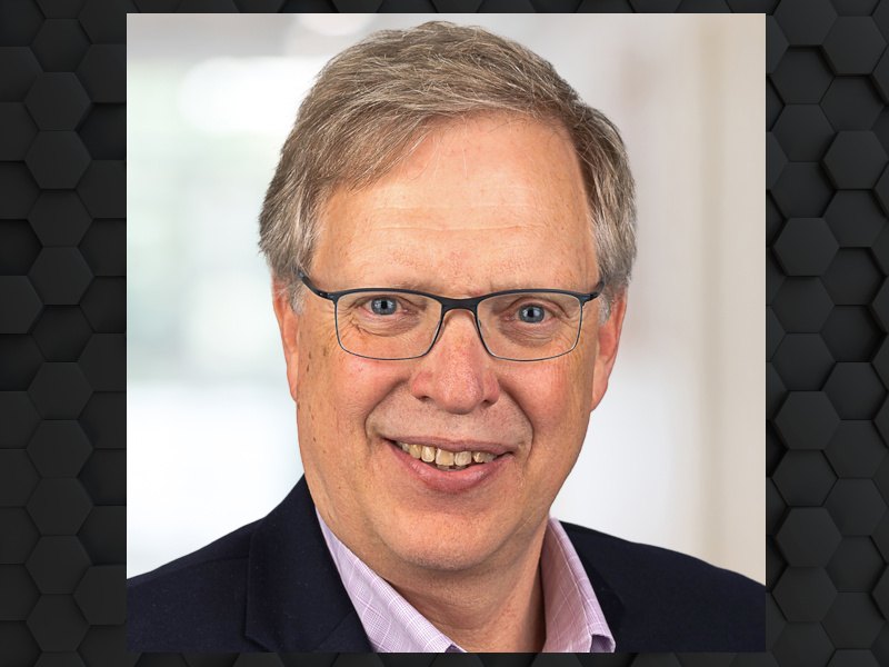 A man wearing a suit and glasses smiles at the camera. He is Richard Tworek, the chief technology officer at Riverbed.