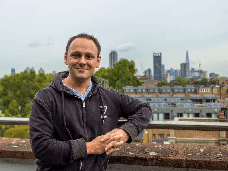 Headshot of Slava Kremerman, CEO and co-founder of Zen Educate, in front of the London skyline.