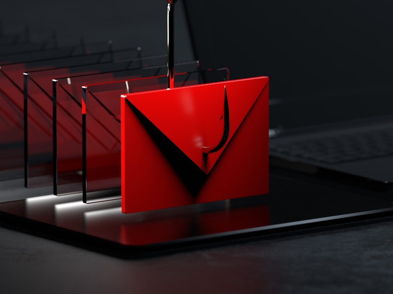 A 3D-graphic of a red envelope hovering over a computer with a fishing hook going through it, symbolising phishing cyberattack techniques.