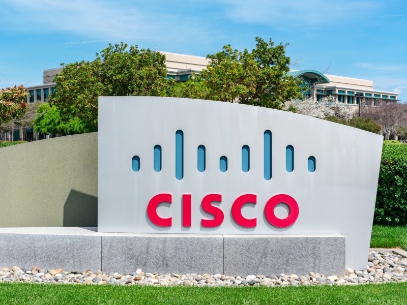 The Cisco logo on a sign in front of a building.