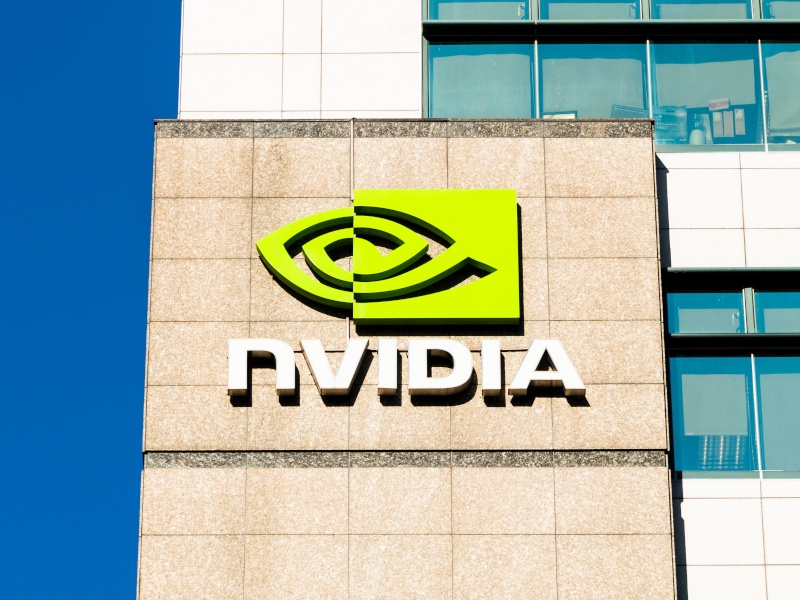 The Nvidia logo on a sign on the side of a building.