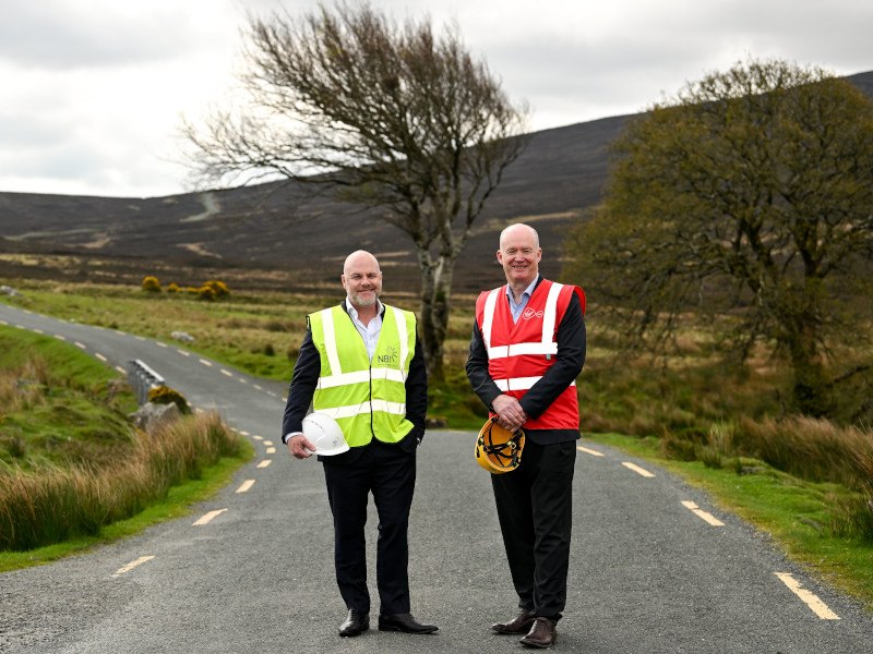 The CEOs of Virgin Media Ireland and National Broadband Ireland standing together on a road.