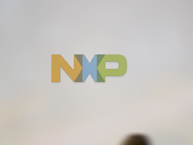 The Nexperia logo on a blank wall.