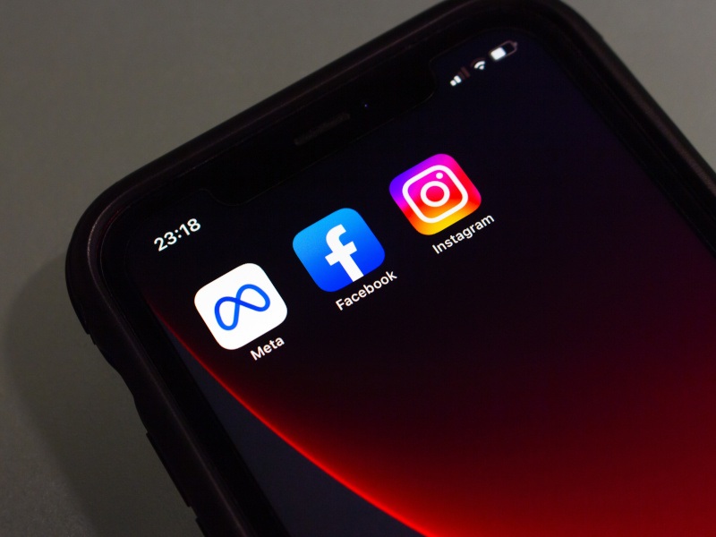 The logos of Facebook, Instagram and Meta on apps on a smartphone screen.