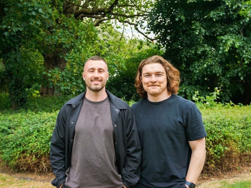 Headshot of Solidroad founders Mark Hughes and Patrick Finlay in an outdoor space.