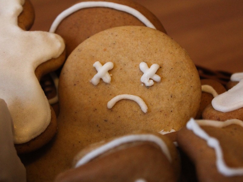 Close-up of the sad frowning face of a gingerbread-man cookie.