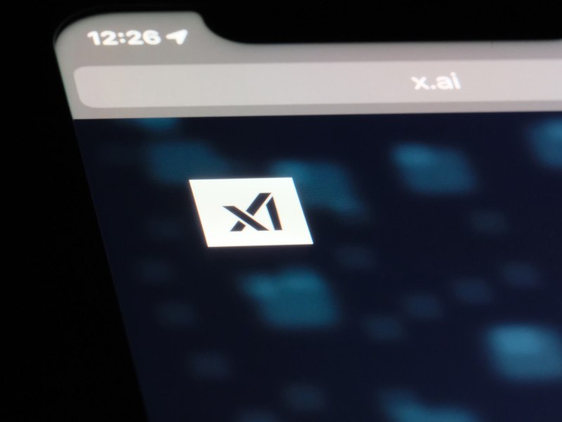 xAI logo on a smartphone screen in the dark.