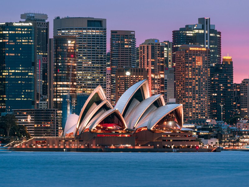 Skyline of Sydney, Australia, with the Sydney Opera House in focus in the centre of the image..