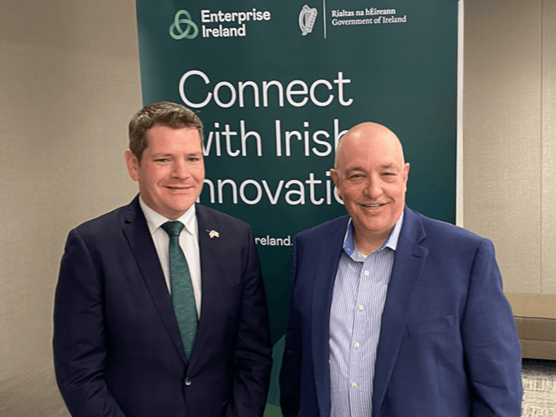 Headshot of two men with an Enterprise Ireland poster behind them.