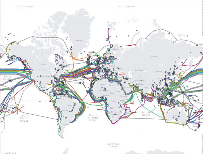 A map of the world with many lines connecting different parts, highlighting the subsea cables all over the world.