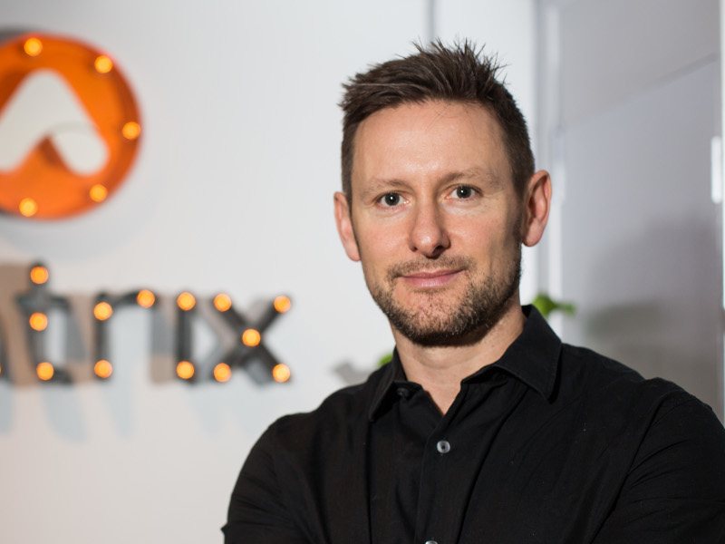 An image of Jeff Sheridan with a portion of the Matrix Internet logo on a wall in the background.