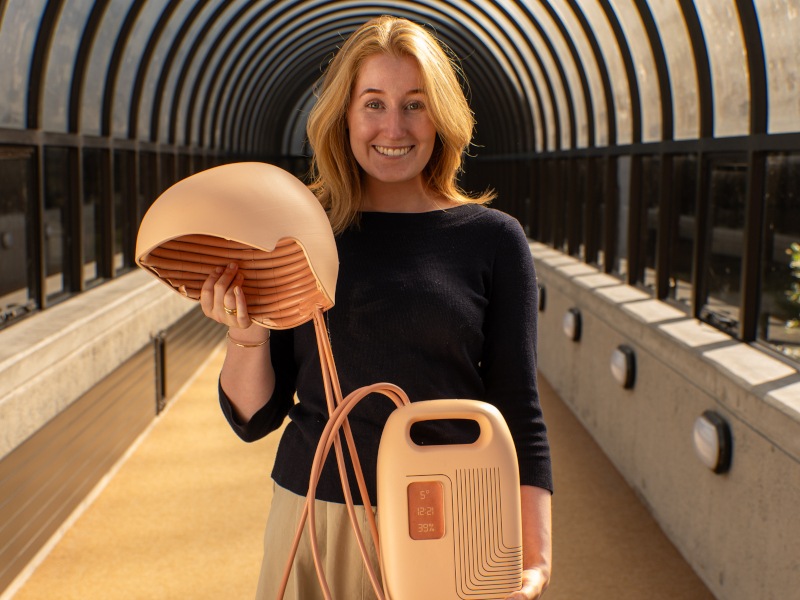 Olivia Humphreys in a tunnel holding the Athena device.