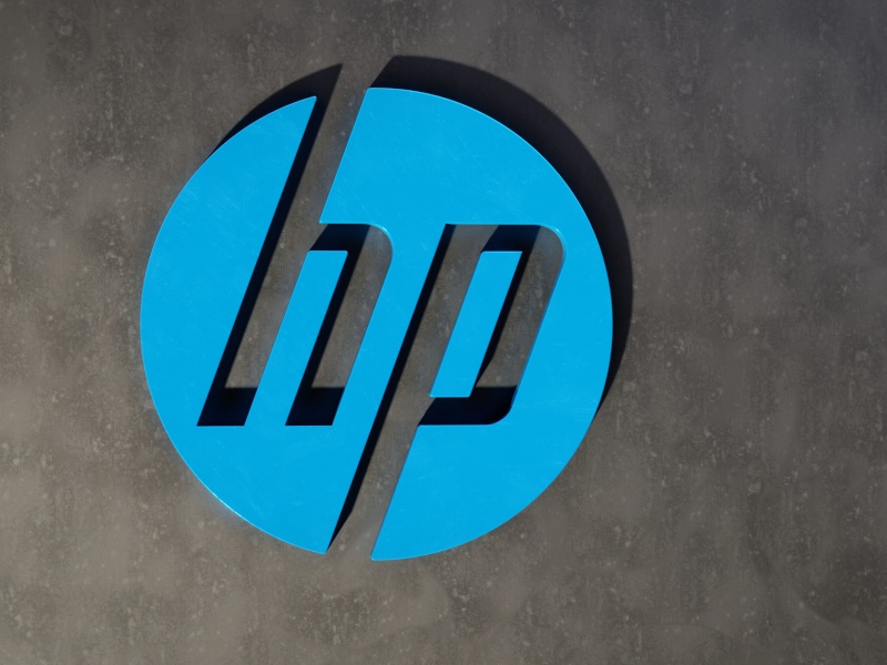 A HP logo on a grey wall. Used for the context of HP's legal battle with Mike Lynch and his estate.