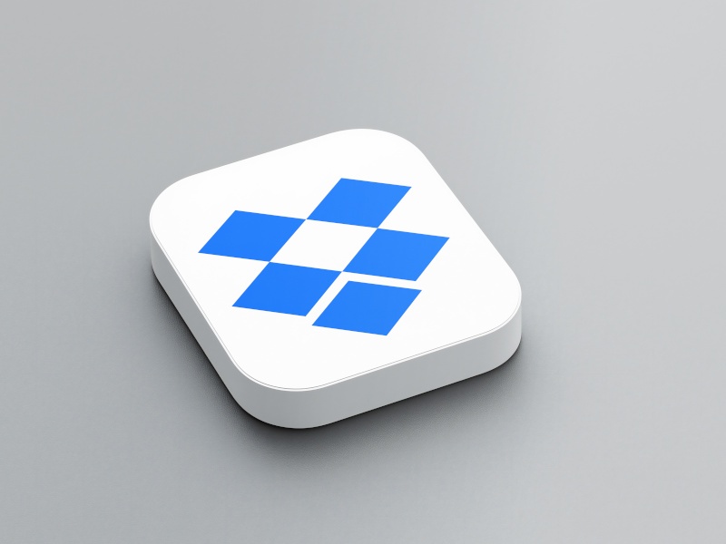 A 3D rendering of the blue Dropbox logo on a white tile sitting on a grey background.