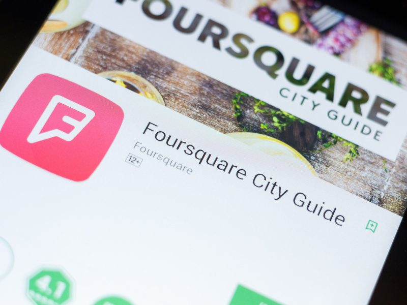 A close-up of the Foursquare City Guide app on a mobile phone.