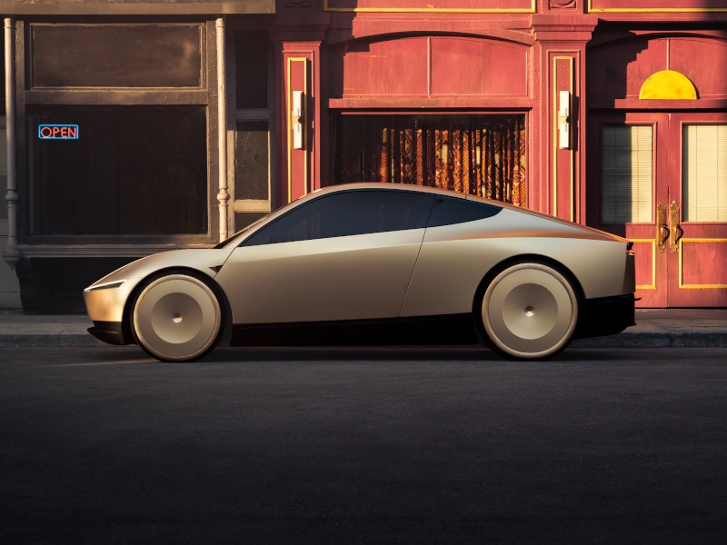 Tesla's new Robotaxi with a sleek design. The car is monochrome copper in colour.