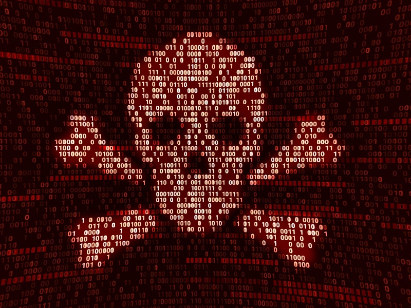 An image covered in red ones and zeros with a lighter section in the shape of a skull and bones, symbolising cybercrime.