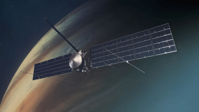 An illustration of the Europe Clipper spacecraft with solar arrays fully deployed orbiting Jupiter.