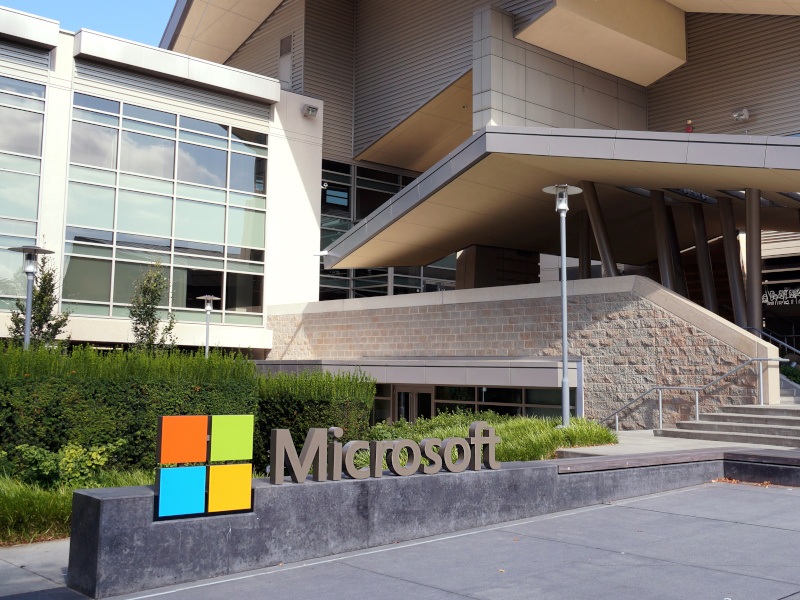 Microsoft offices in daylight with the company logo in the bottom left.