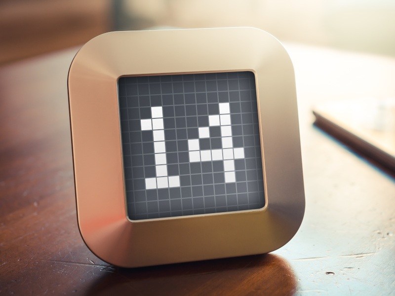 A golden digital tablet displays the number 14 in digital blocks on a desk.