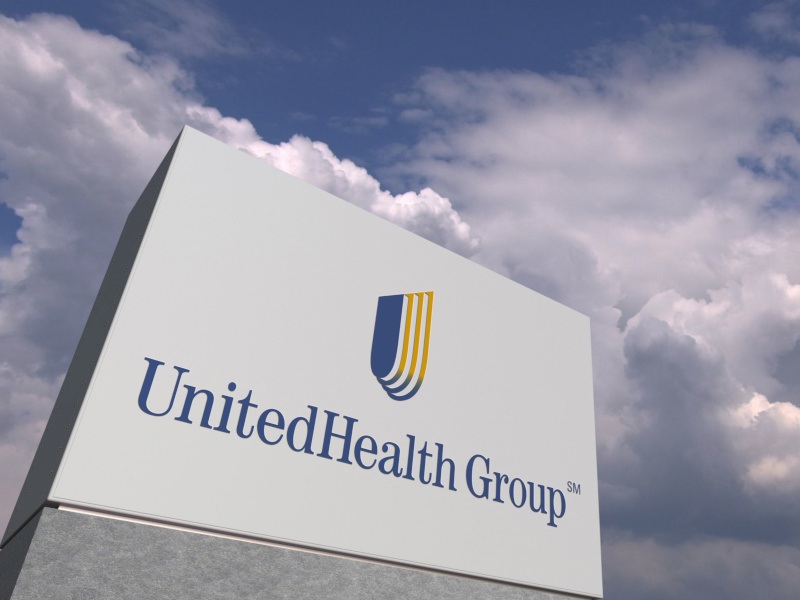 In a 3D rendering, the UnitedHealth company logo with the sky in the back.