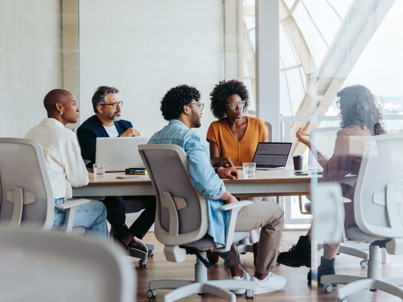 People brainstorming ideas in a modern office.