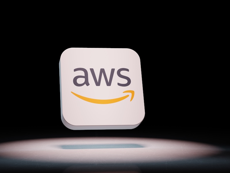 Black background and the AWS logo with a spotlight on it.