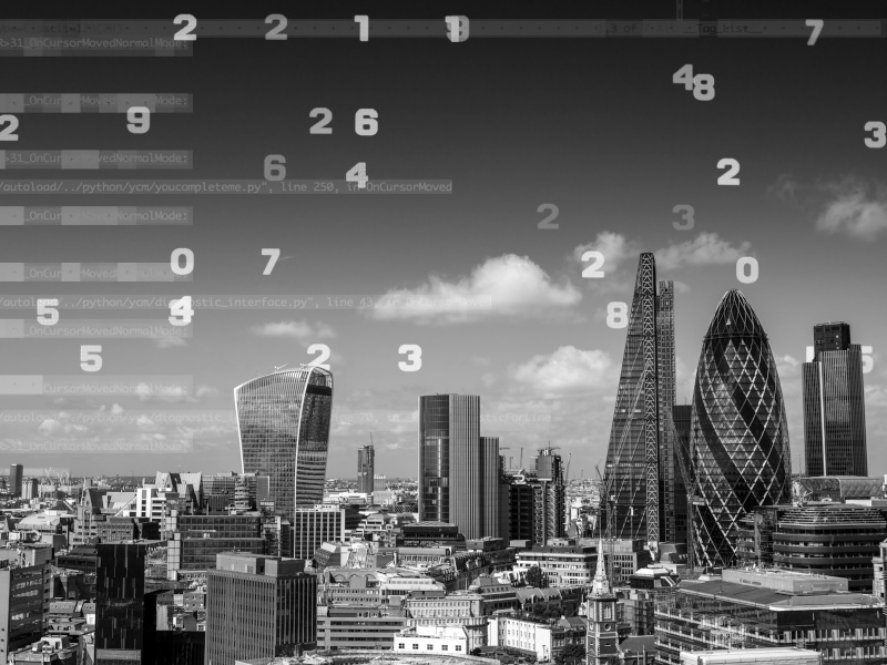 UK skyline in greyscale with numbers floating to denote cyberattacks.