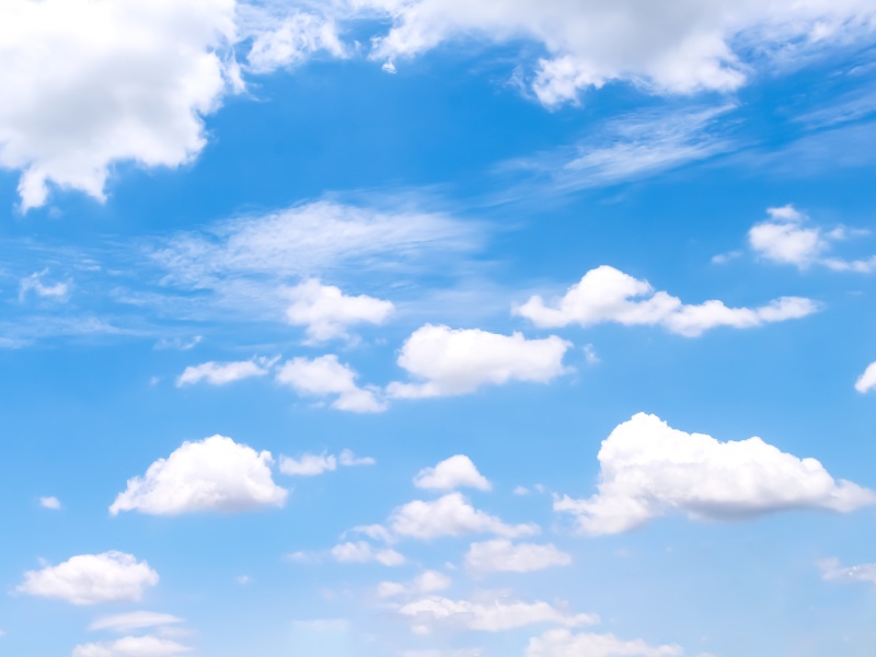 A blue sky with clouds representing social media site Bluesky.