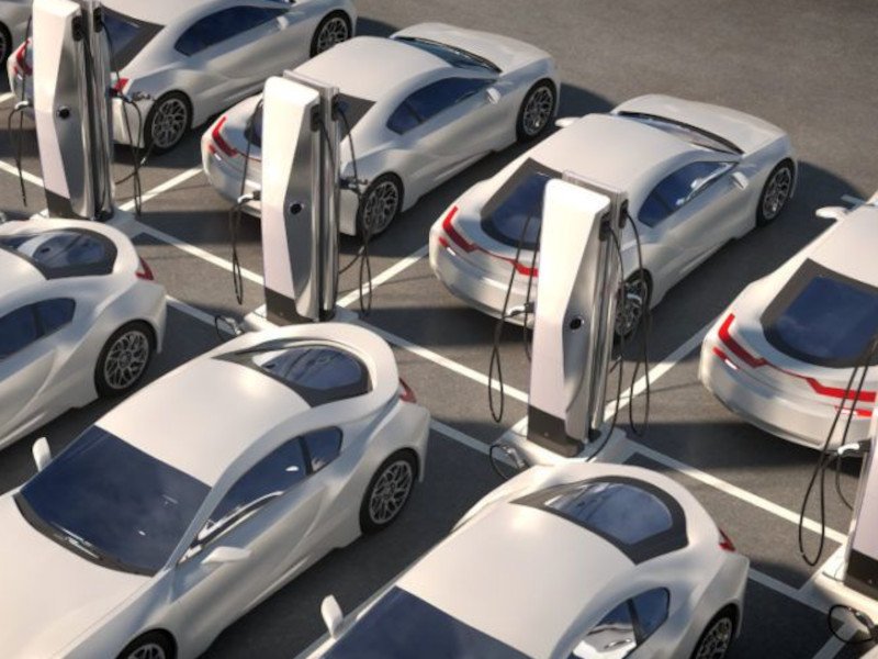 A number of parked electric vehicles (EV). This image is meant to symbolise EV sales in the UK and Germany.