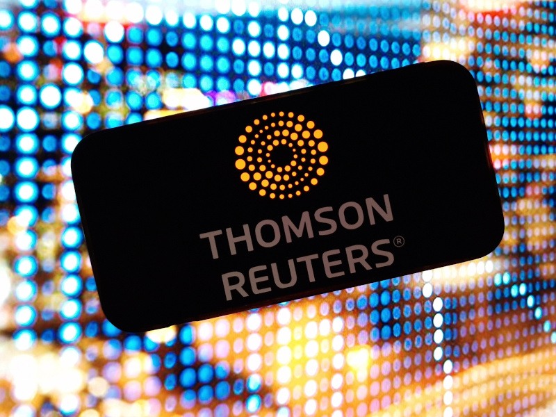 A smartphone displaying the Thomson Reuters logo.